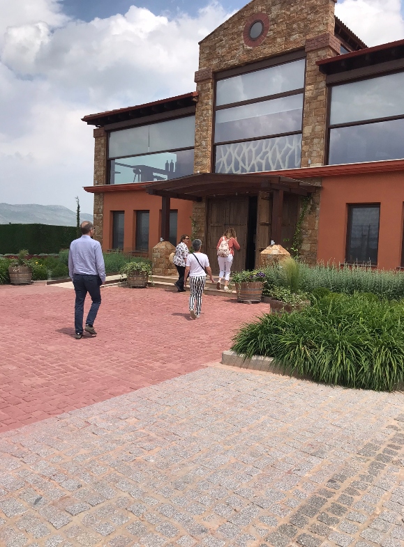 Wine tourists enter Alpha Estate building to take part in a wine tour of the winery