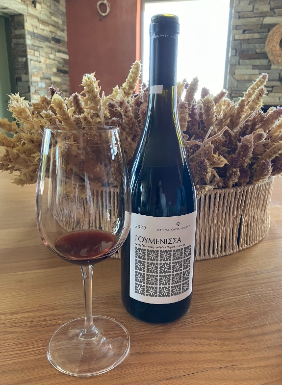 A bottle of Goumenissa PDO wine from Chatzivarity winery and a half drank wine glass