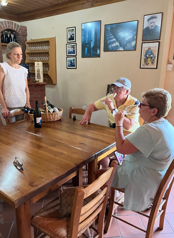 Two people wine tasting along with the winemaker